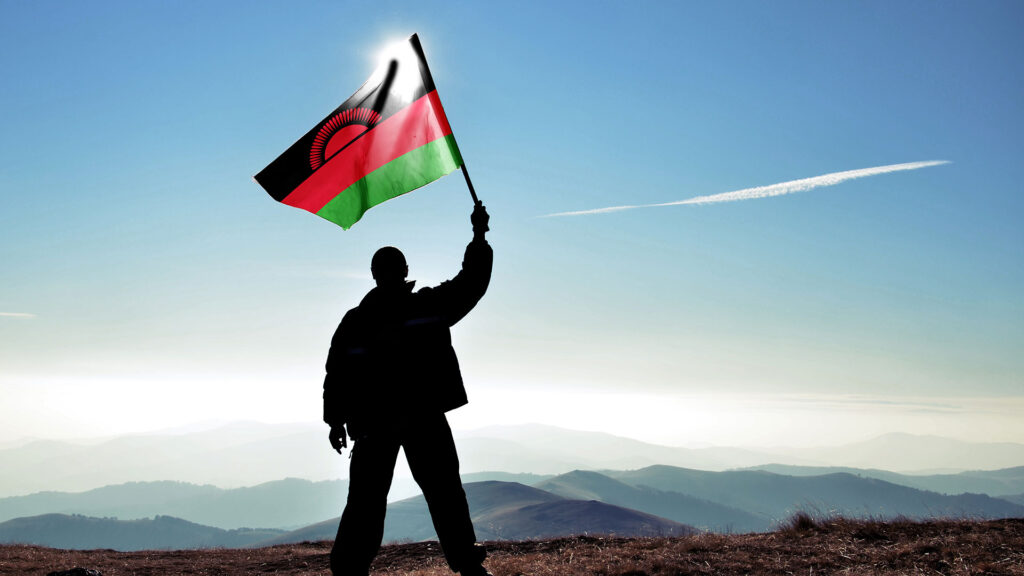 A man with Malawi flag
